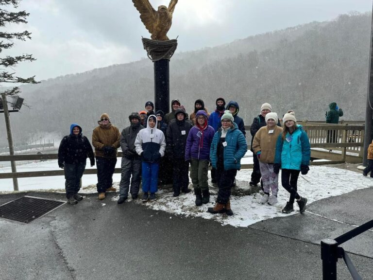 Troop group photo at a snowy mountain overlook